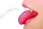 open mouth and tongue cleaner - mouth hygiene (isolated on white)