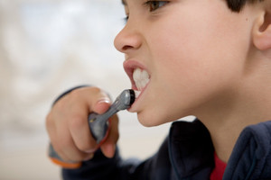 Boy brushing teeth