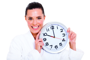 portrait of pretty woman holding a clock
