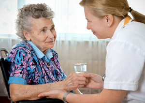 Senior woman with a her home caregiver